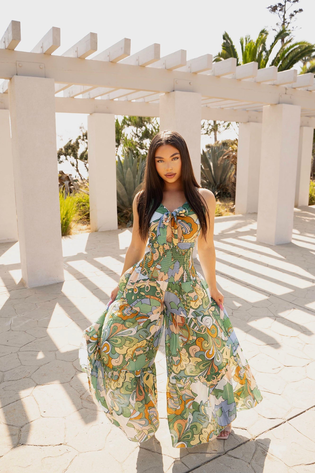 https://cdn.shopify.com/s/files/1/0293/9277/files/6-11-2024__144__Kamiyah_printed_jumpsuit_GF.jpg?v=1722558006