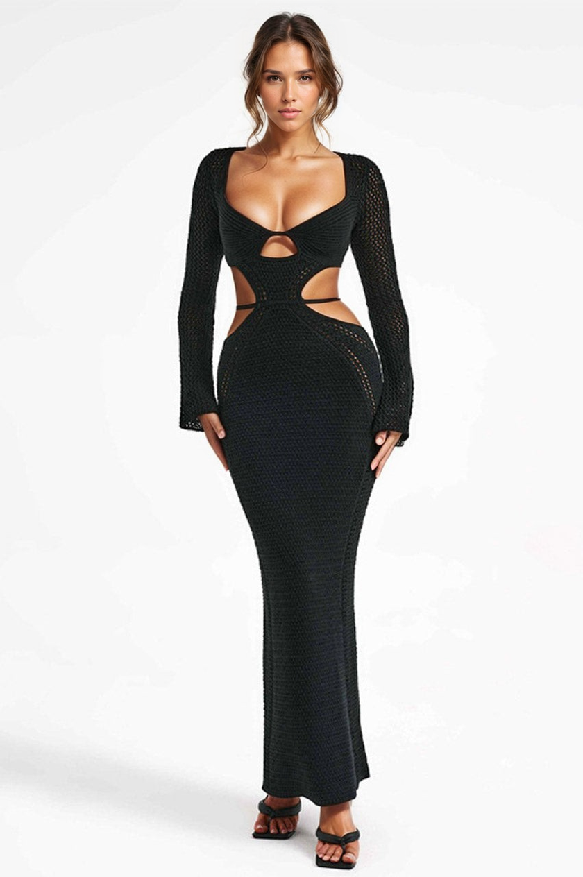 Black long-sleeve dress with cut-out design on a white background